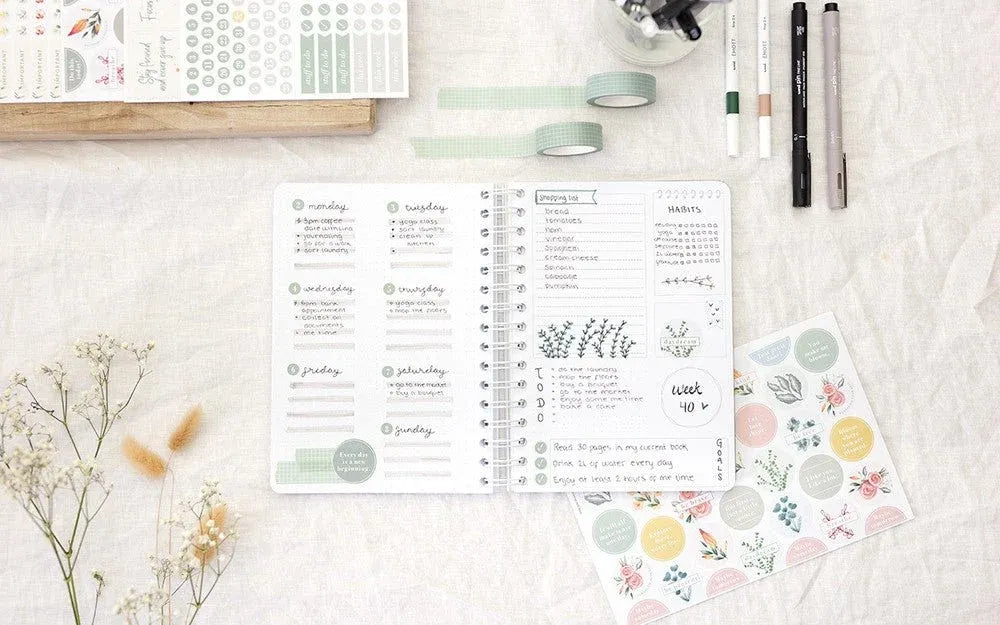 Bullet journal with custom stickers made using a NIIMBOT label printer